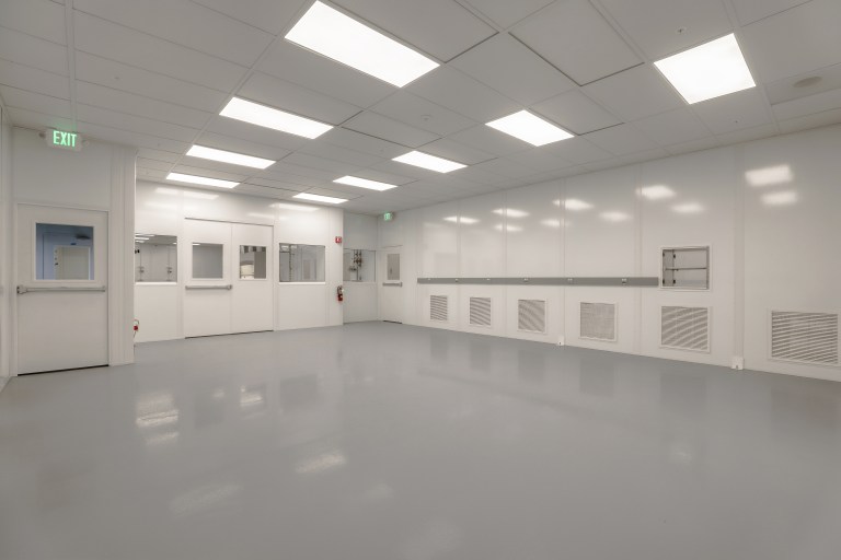 An ISO 7 Cleanroom uses hardwall panels and can be customized to a variety of manufacturing specification.